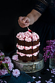 Chocolate layer cake with blackberry buttercream filling
