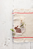 A picture of a rabbit with Italian labels on a tea towel