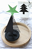 Black paper Christmas tree with green star on top