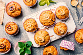 Homemade healthy out banana muffins on gray stone background