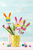 Straws decorated with craft paper Easter bunny faces