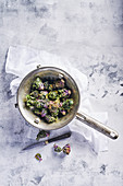Flower sprouts, calettes in sieve