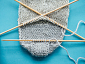 A sock being knitted: three-section heel turn
