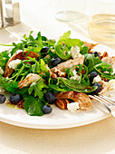 Blueberry and chicken salad with rocket