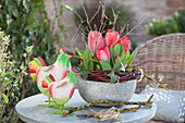 Red Tulips In A Gray Shell