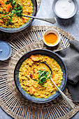 Red lentil and pumpkin soup with turmeric and coconut milk