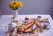 Braided sweet Easter bread served for breakfast with butter and jam