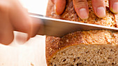Slicing bread (close-up)