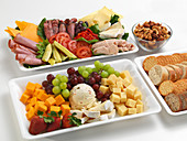 Various savory and sweet snacks on platters