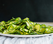 Thinly sliced zucchini on a plate