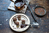 Handmade truffle pralines with chocolate sauce