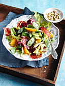 A winter salad with oranges, pistachios and chorizo chips