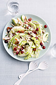 Iceberg wedge salad with blue cheese, grapes and smoked chicken