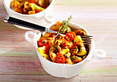 Small portions of pasta with vegetables and tomato sauce
