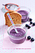 Baby food made from melba toast and blueberries