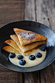 French Toast with vanilla sauce and blueberries