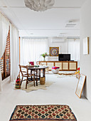 Ethnic-style artist's apartment with white floor