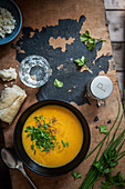 Pumpkin soup with chives and parsley, view from above