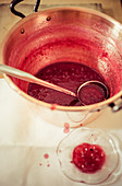 Lingon berry jam being made, setting test