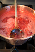 Lingon berry jam being made, jam boiling in a pot