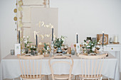 Table festively set for wedding in natural shades