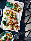 Indian pizza with curried cauliflower and green chilli