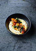 Hummus with chilli peppers and tomatoes