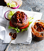 A beefburger with barbecue sauce