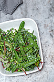 A salad made with mange tout, peas, beans and tarragon