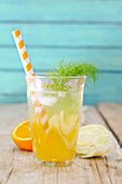 A glass of fennel and orange iced tea