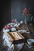 A sponge cake on a rustic kitchen table