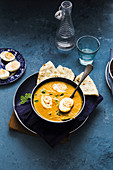 Egg Curry served with Naan Bread