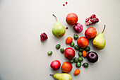 Varitety of fresh summer fruits on neutral background