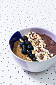 Vegan breakfast bowl with blueberry smoothie and banana