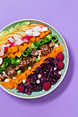 A vegan rainbow bowl with pickled tofu
