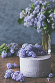 Rustic layer cake with lilac blossom