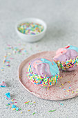 Meringue ice cream sandwich cookies with colorful sprinkles