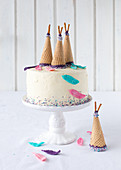 An Indian cake decorated with ice cream cones for a child's birthday