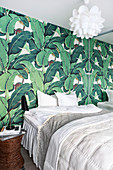 Wallpaper with pattern of topical leaves in bedroom