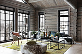Modern living room in log cabin with lattice windows
