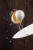 An egg cracked with a knife