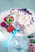 Ice cream with fresh berries in a sundae glass