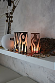 Handmade tealight holders with tree-trunk motif