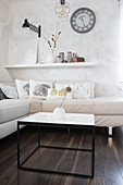 White modern living room with subtle autumn decorations