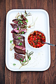 Grilled saddle of lamb with pointed cabbage salsa