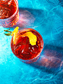 Negroni cocktails high angle on blue