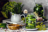 Pickled gherkins in a jar with garlic and dill