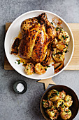 Stuffed roast chicken with salted lemons and spiced potatoes