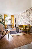 Mustard-yellow sofa and table and chairs below window in living room