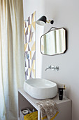 Washstand with countertop sink and shower area behind curtain in bathroom